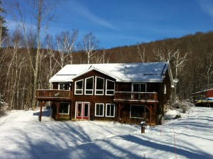 snow on solar panels in Vermont