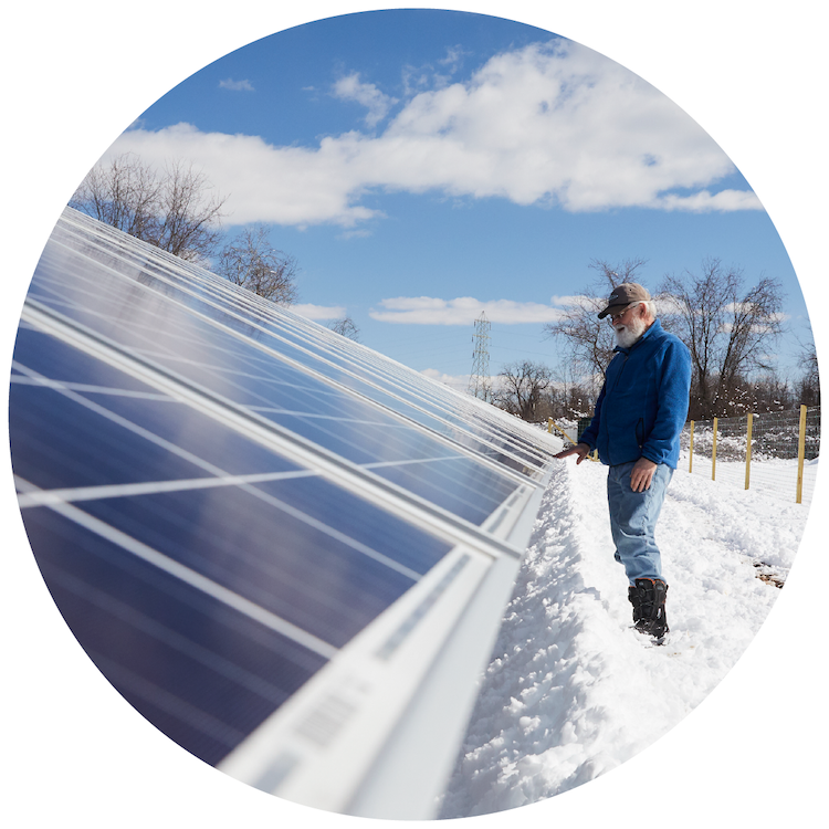 CSA Member Touches Solar Panels