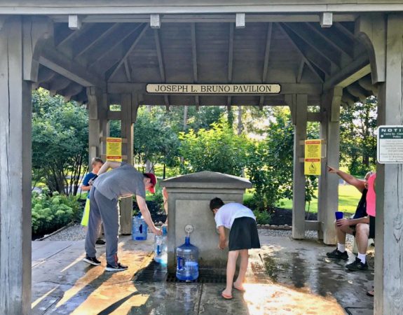 saratoga springs people filling water sustainably