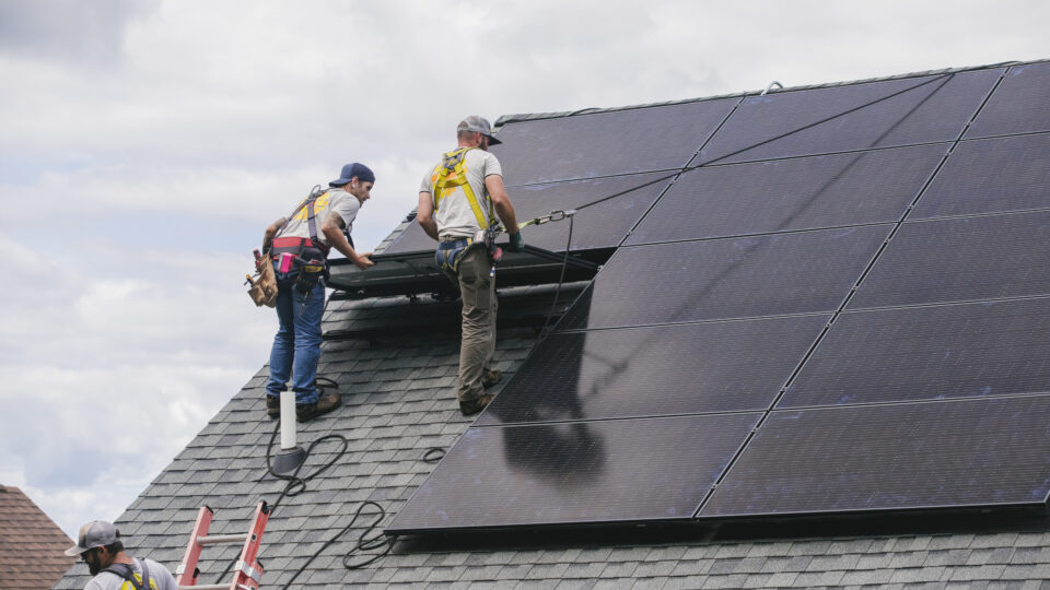 SunCommon solar installation crew on a rooftop